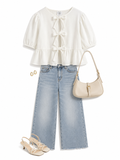 Blusa moñitos abullonada